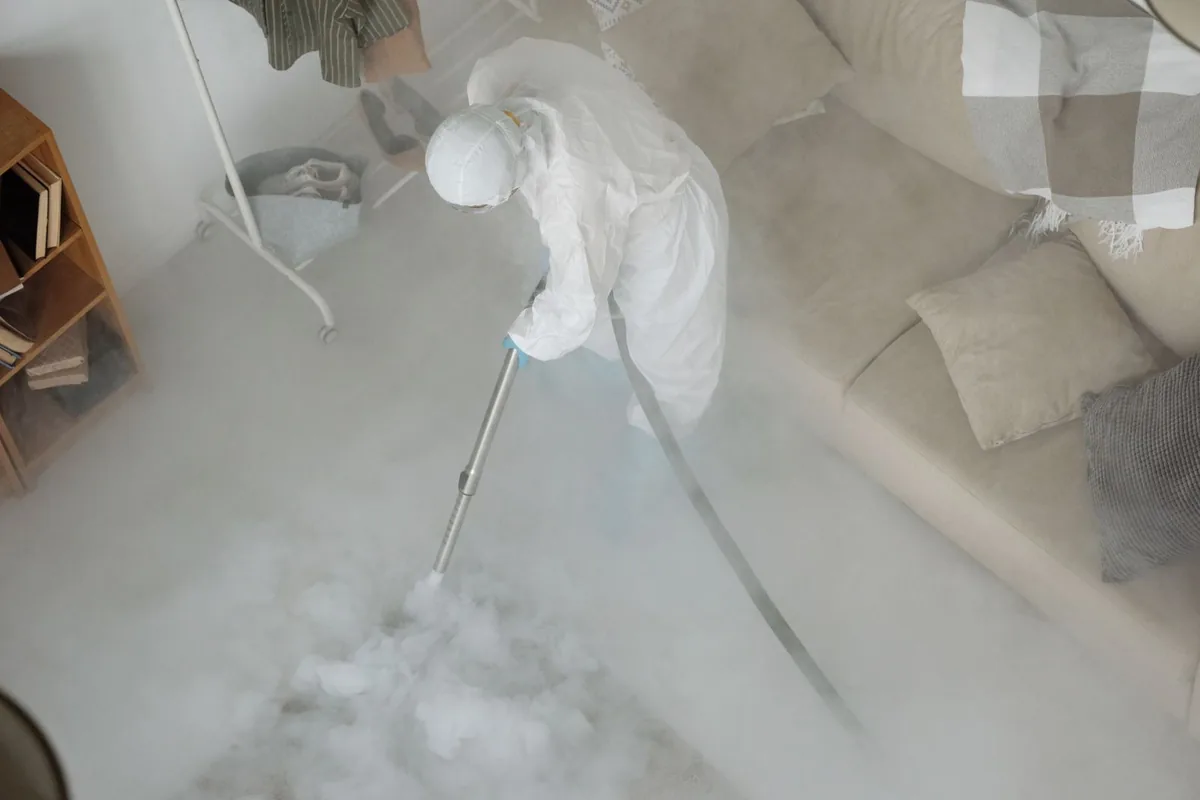 Biohazard cleanup technician in protective equipment, Stamford, TX